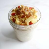 Single serving of apple butter overnight oats in a mason jar.