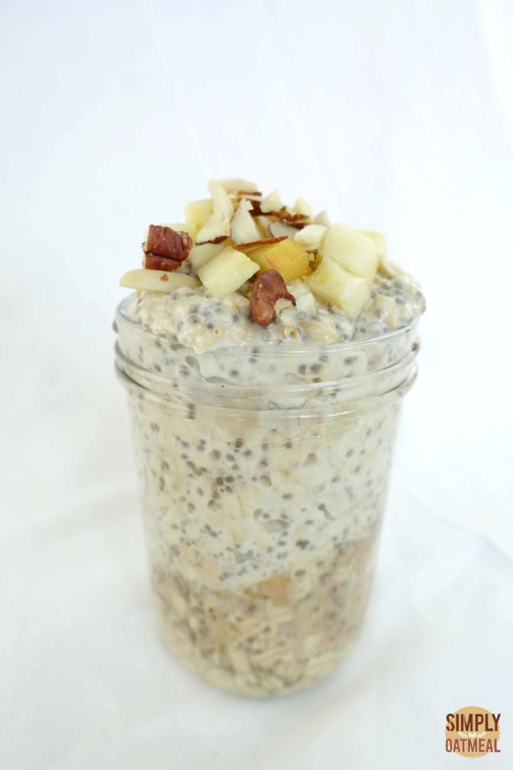 Single serving of apple chia overnight oats in a glass container.