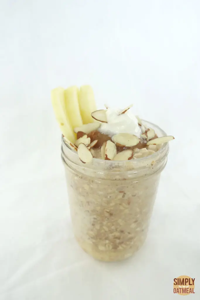 One serving of apple cinnamon overnight oats in a glass container.