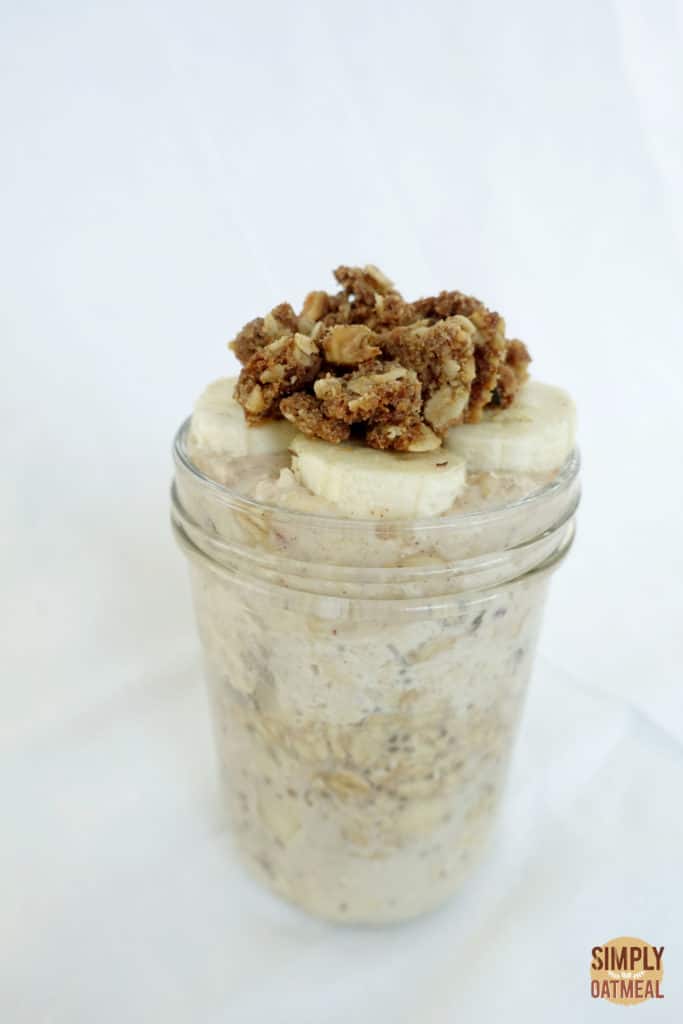 Single serving of overnight oatmeal in a mason jar with crispy crumble topping.