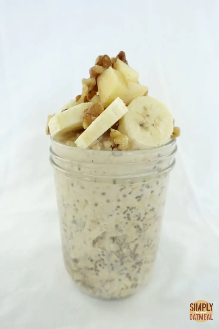 A single serving of apple walnut overnight oats in a mason jar.