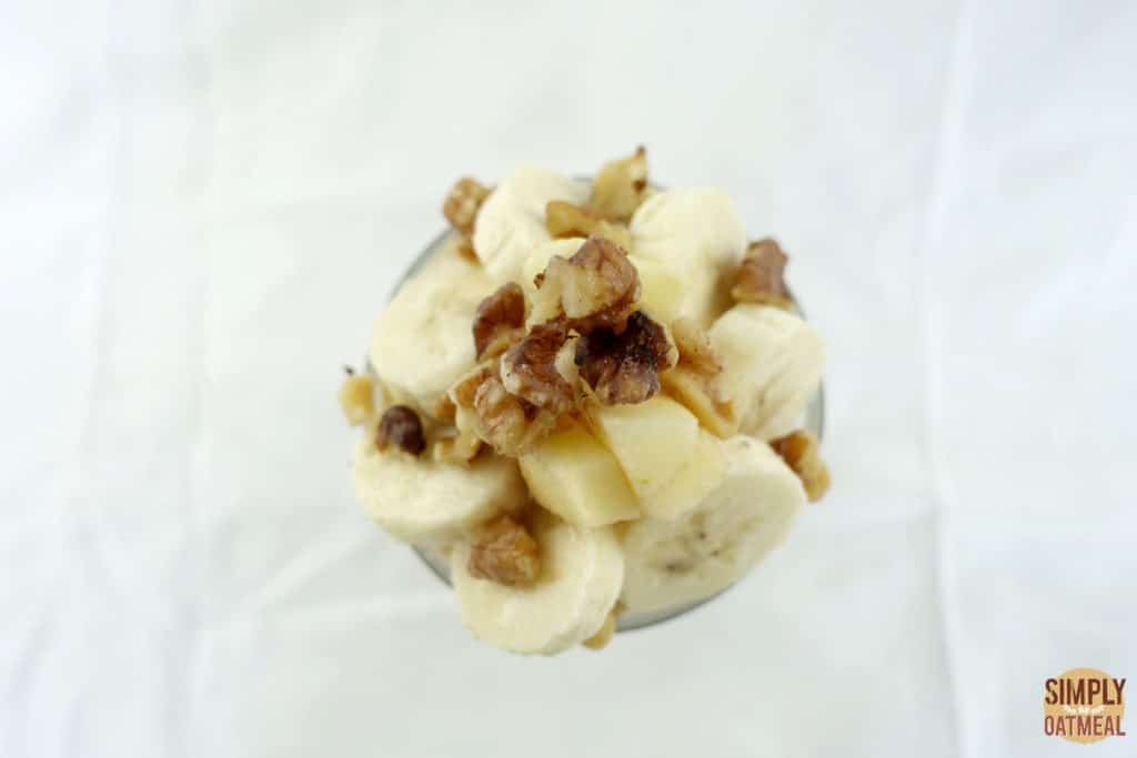 Sliced banana, diced fresh apple and chopped walnuts on top of overnight oatmeal.