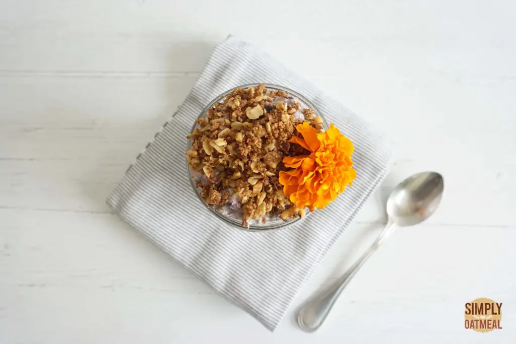 Bowl of blueberry honey overnight oats Bowl of blueberry honey overnight oats topped with crunchy granola and an edible flower