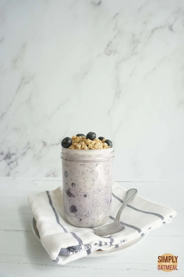 Single serving of blueberry pie overnight oats in a mason jar.