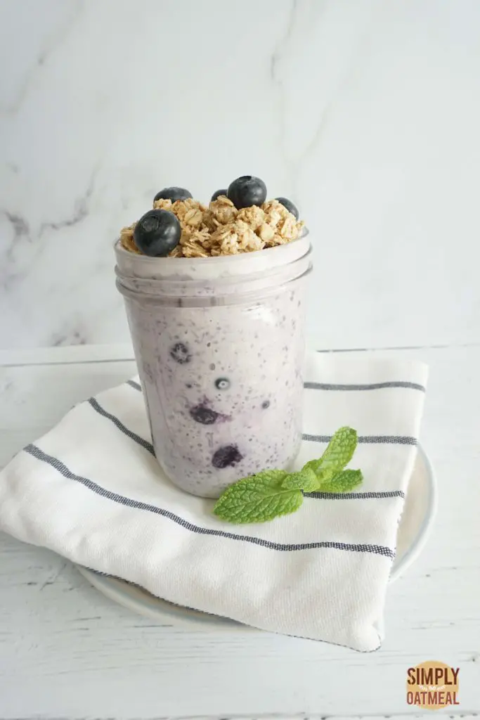 One serving of blueberry pie overnight oats in a glass container
