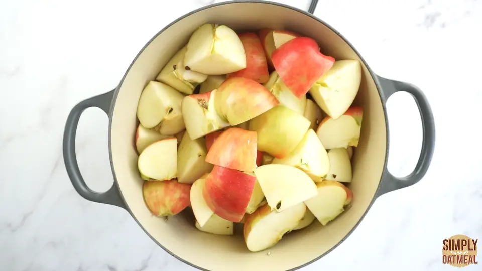 Chopped apples inside a large dutch oven prepared to start cooking this easy apple butter recipe