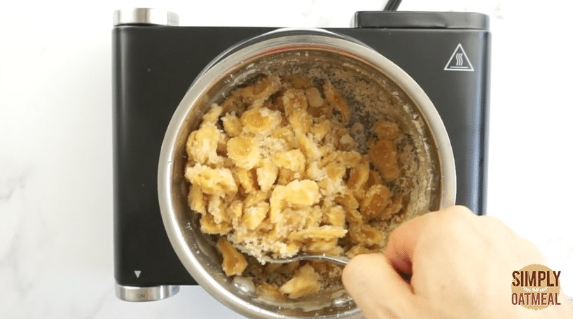 evaporate the water until the sugar crystalizes on the soft ginger.