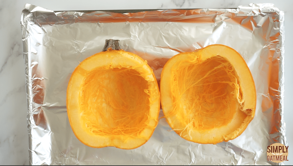 place cut pumpkin on a baking sheet flesh side down