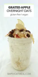 Grated apple piled high on top of soaked overnight oats in a glass container.
