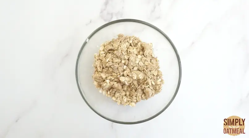The butter has been worked into the oatmeal crumble topping until it forms pea-sized crumbles.