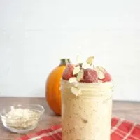 pumpkin greek yogurt overnight oats in a tall glass jar