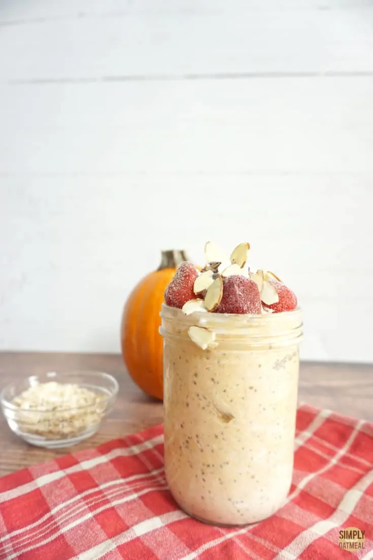 pumpkin greek yogurt overnight oats in a tall glass jar