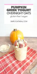 pumpkin greek yogurt overnight oats with whipped cream, strawberries and sliced almonds on top.
