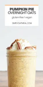 pumpkin pie overnight oats in a glass jar topped with whipped cream, pecans and a sprinkle of cinnamon
