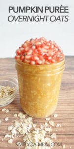 single serving of pumpkin puree overnight oats in a glass container. Raw oats decorate the wooden table.