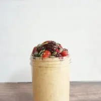pumpkin seed overnight oats in a tall glass jar