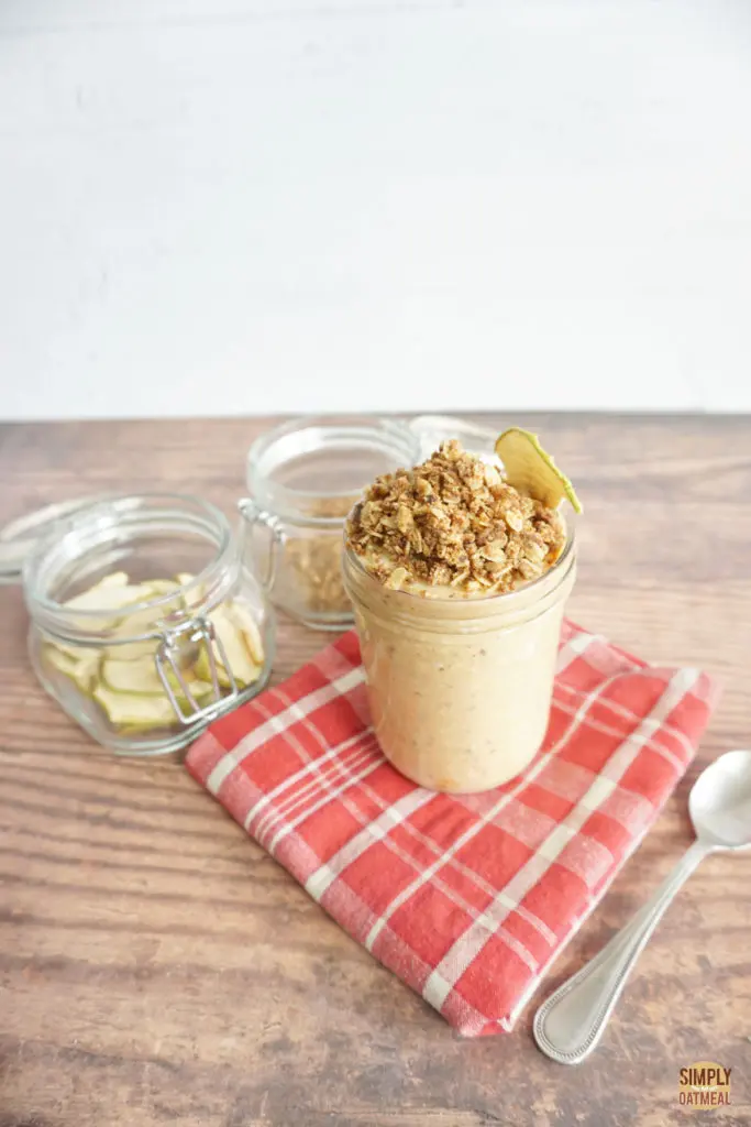 pumpkin spice overnight oats topped with crunchy granola and dried apple chips