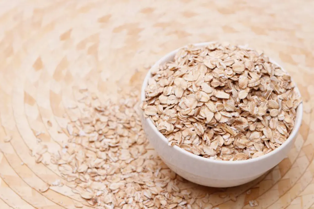 Rolled oats in a white bowl