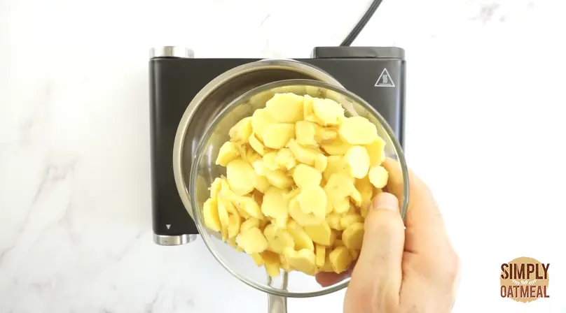 Slice fresh ginger to even thickness using a mandoline