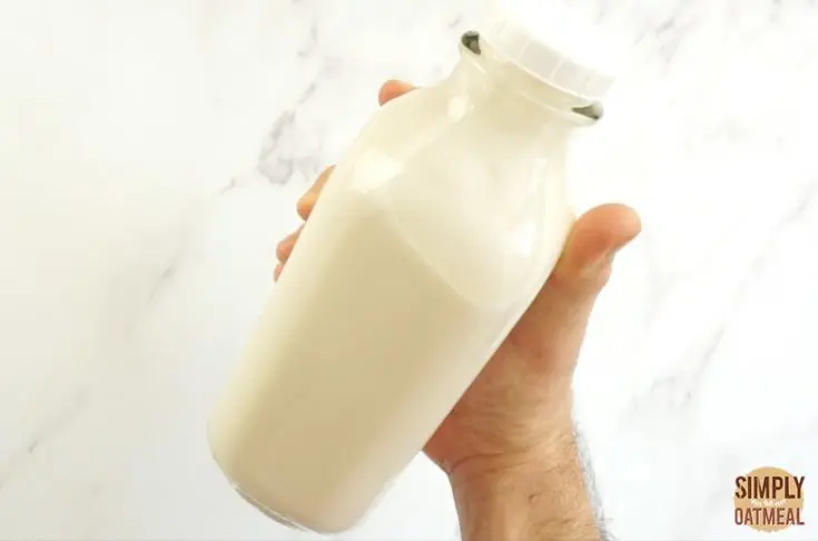 soy milk in a glass bottle ready to go inside the refrigerator