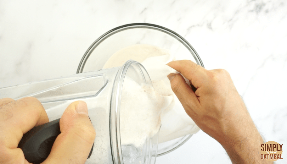 Pour the blended almond milk into a nut milk bag to fully strain out the almond pulp.