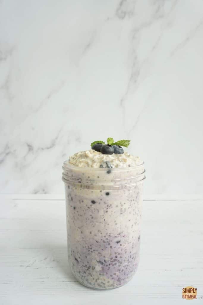 Single serving of vegan blueberry overnight oats in a glass container