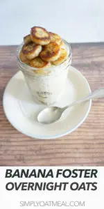 One serving of banana foster overnight oats with a spoon on the side.