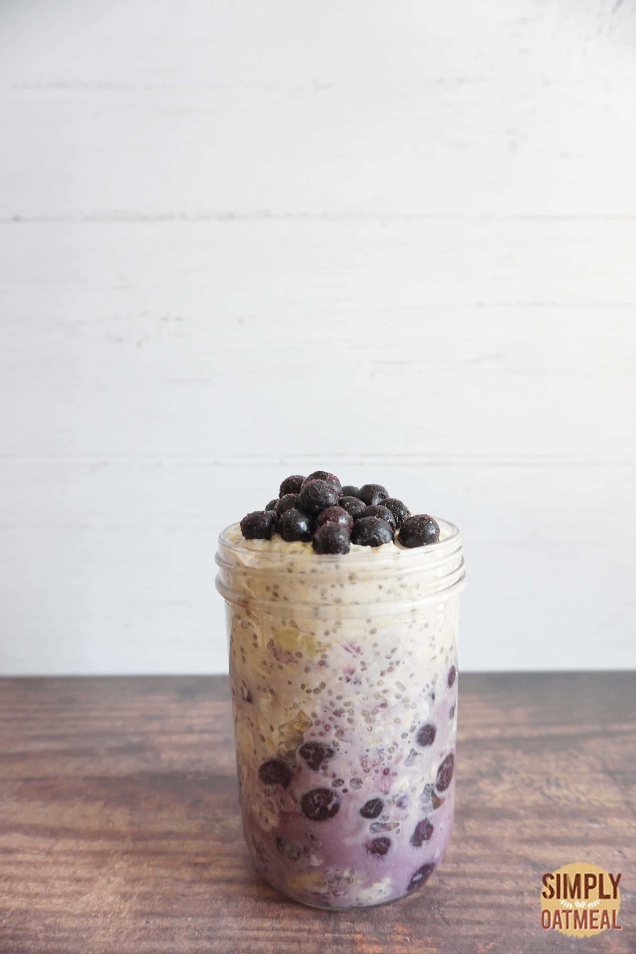 One serving of blueberry banana overnight oats in a meal prep container