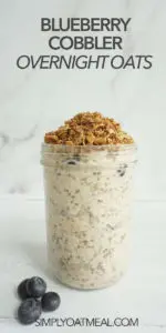 Glass container with one serving of blueberry cobbler overnight oats. The container is full and oven baked cobble topping decorates the top.