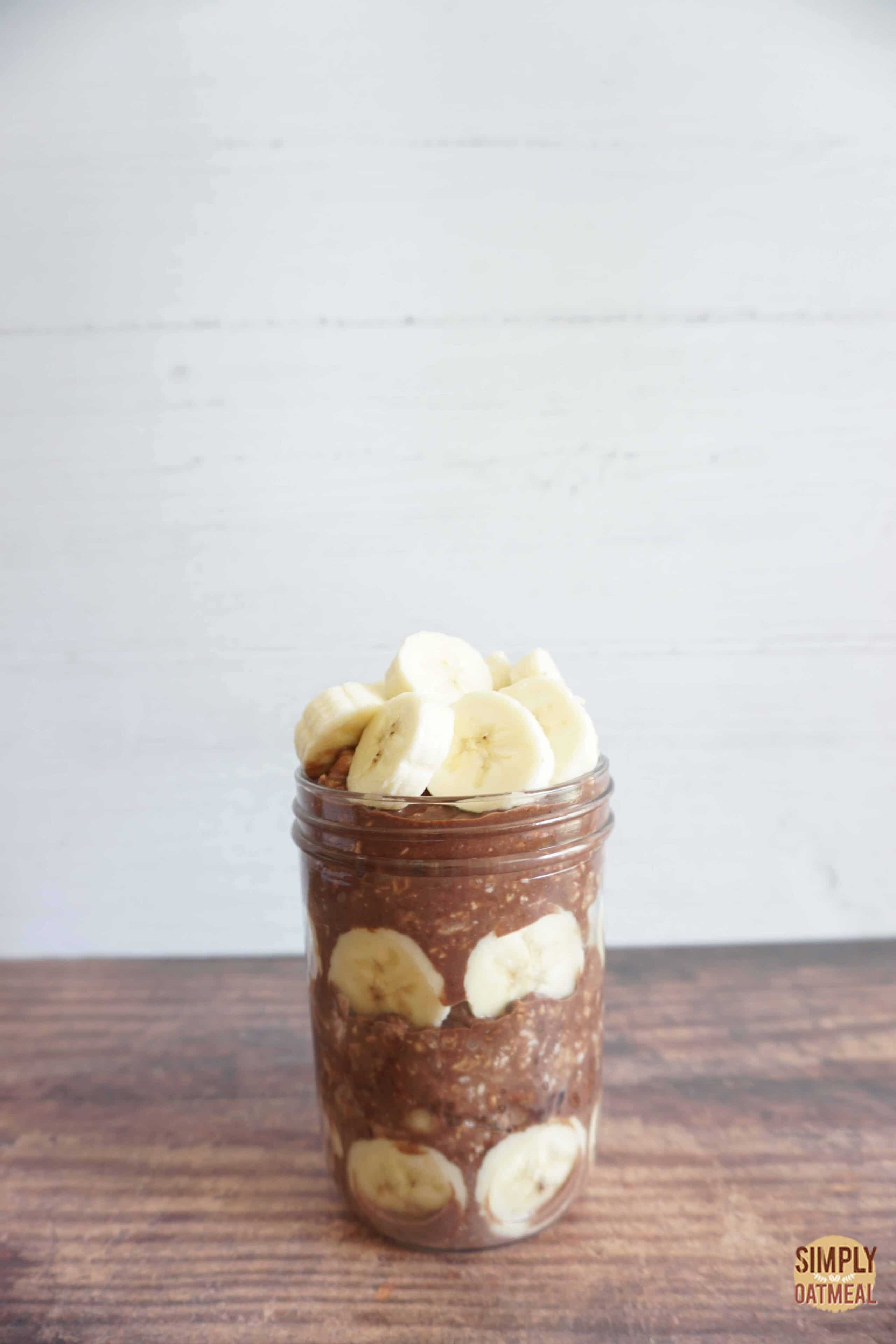 Layer chocolate banana overnight oats in a mason jar.