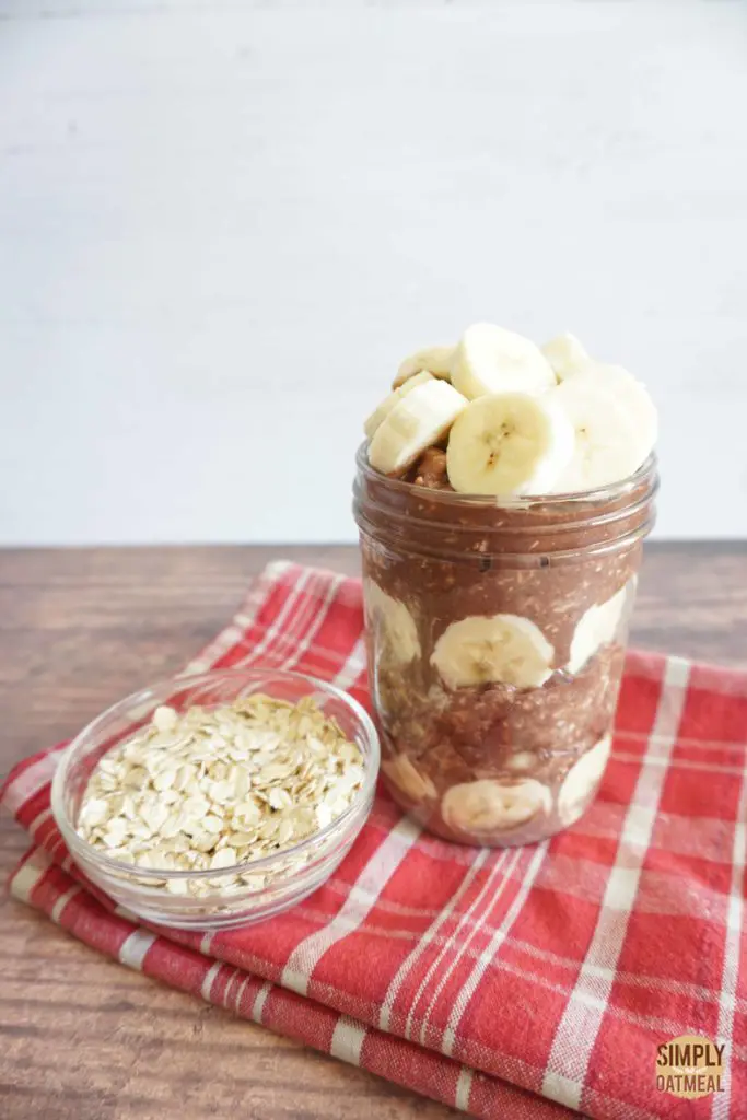 Chocolate banana overnight oats served in a mason jar.