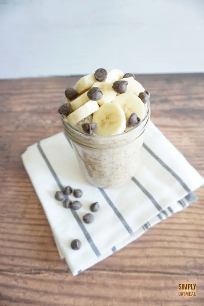 Single serving of chocolate chip banana overnight oats in a glass jar
