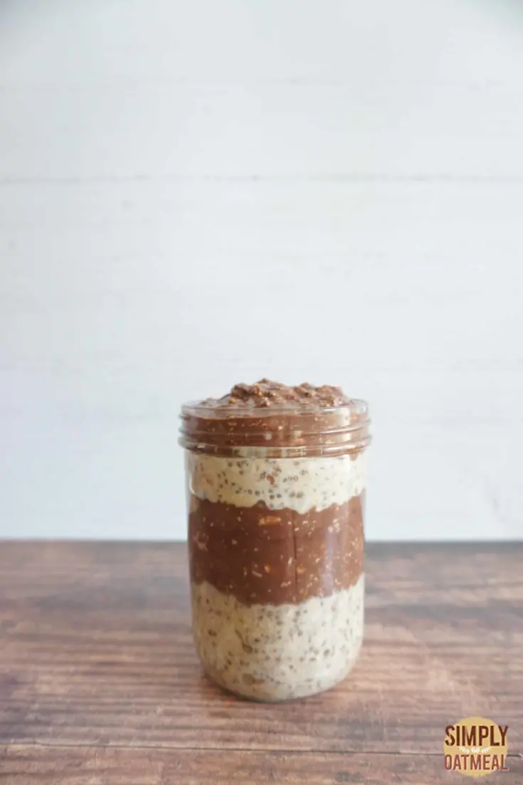 Single serving of chocolate peanut butter banana overnight oats in a mason jar.