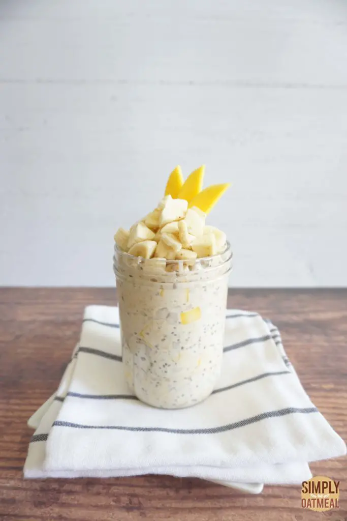 Single serving of mango banana overnight oats in a mason jar