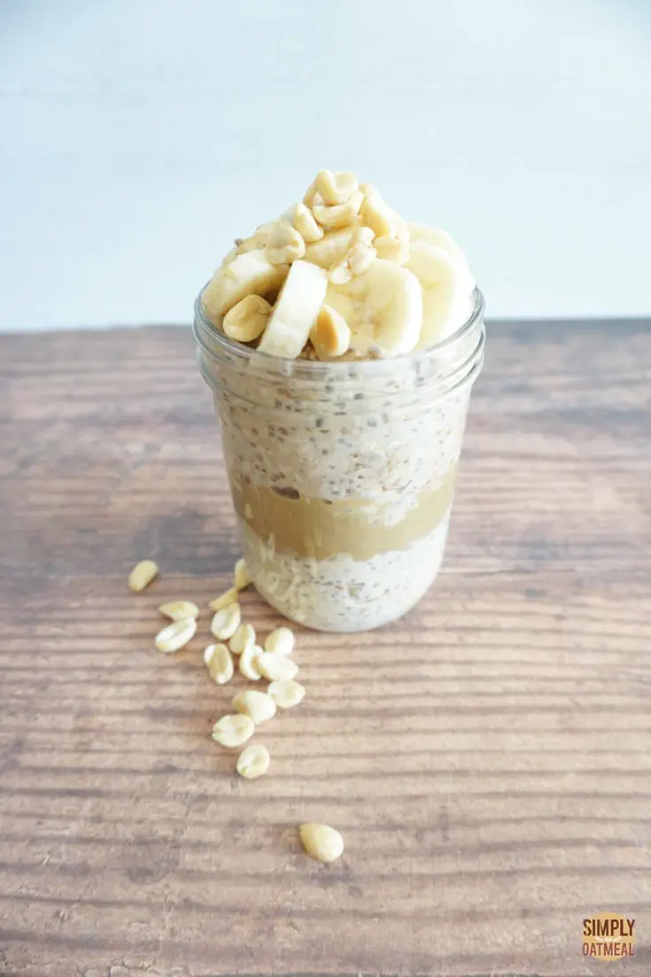 Overnight oats layered with peanut butter and sliced banana on top.
