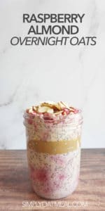 Serving of raspberry almond overnight oats in a glass meal prep container.
