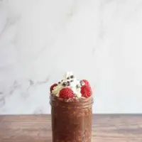 Single serving of raspberry chocolate overnight oats in a mason jar