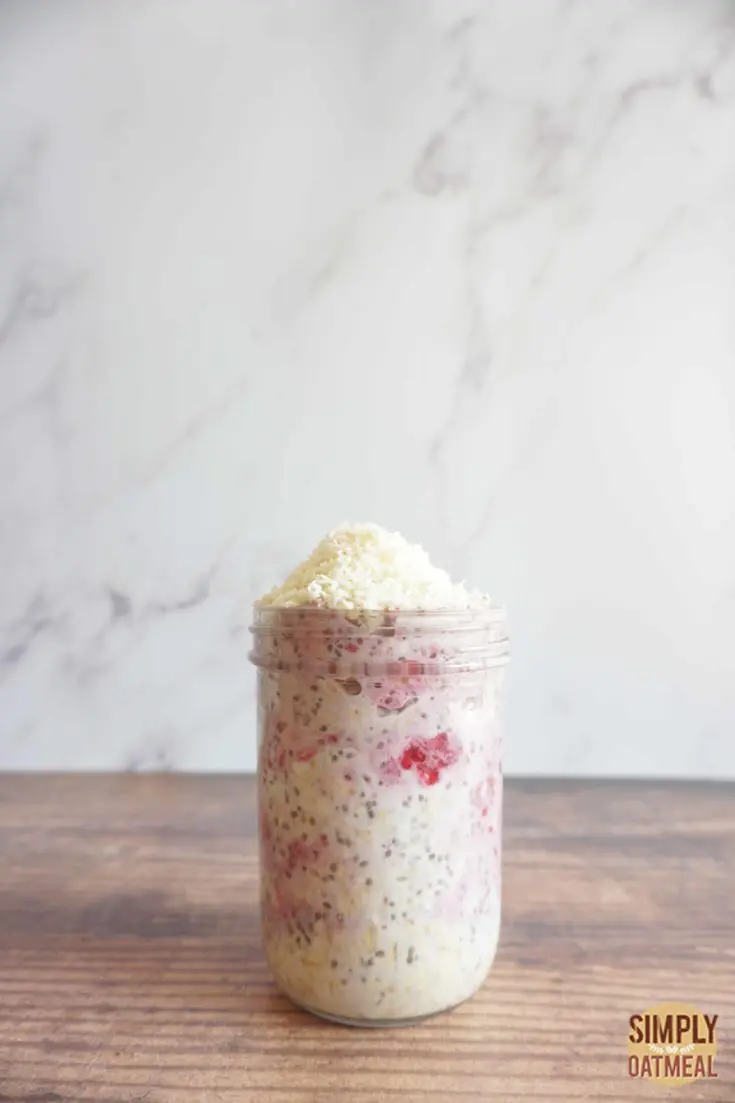 Single serving of raspberry coconut overnight oats in a mason jar