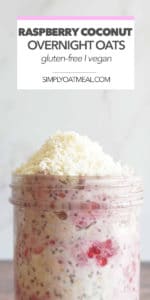 Bowl of raspberry coconut overnight oats garnished with a mountain of unsweetened coconut flakes.
