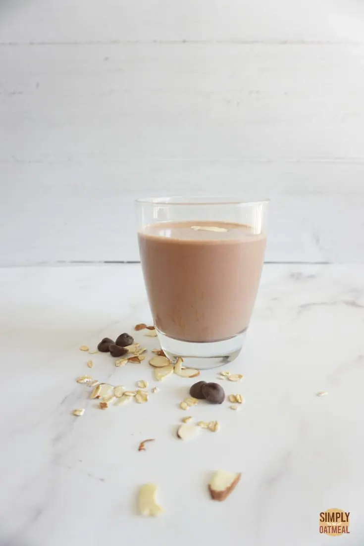 Single serving of almond joy oatmeal smoothie in a glass cup