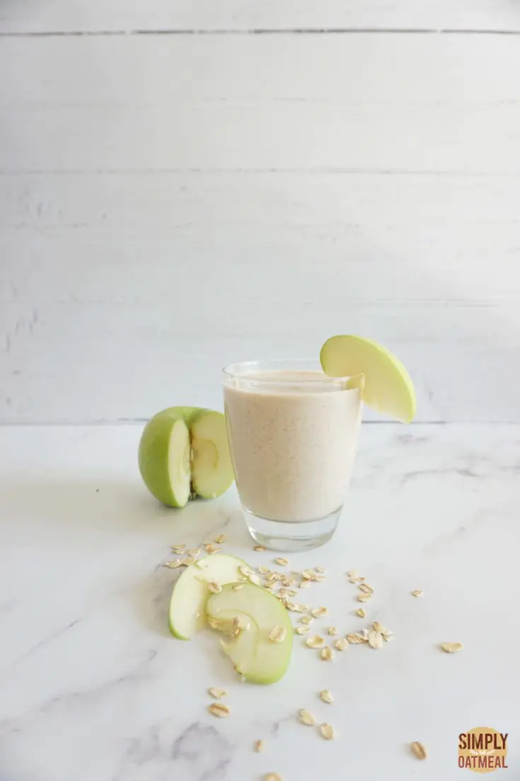 Serving of apple pie oatmeal smoothie in a glass cup