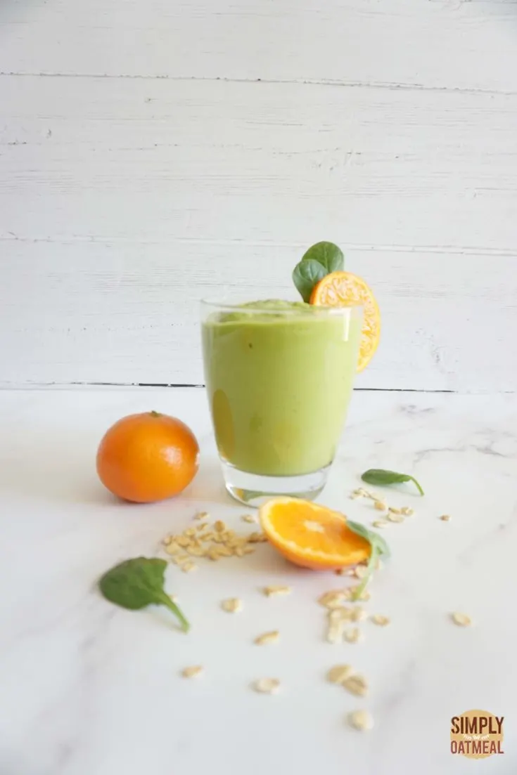 Single serving of avocado dreamsicle oatmeal smoothie in a glass cup.