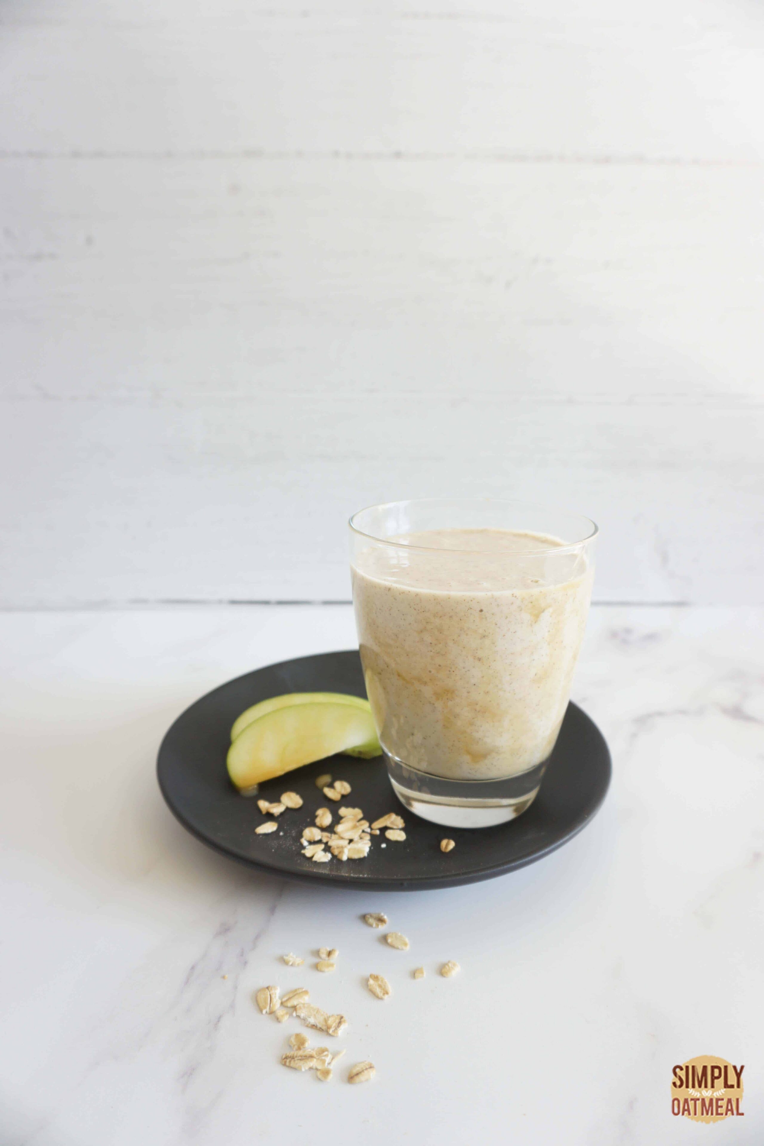 Single serving of caramel apple oatmeal smoothie in a glass cup