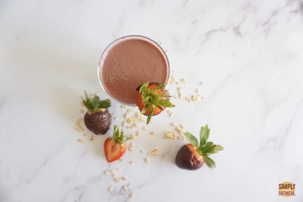 Chocolate covered strawberry oatmeal smoothie. Chocolate dipped strawberries on the side.