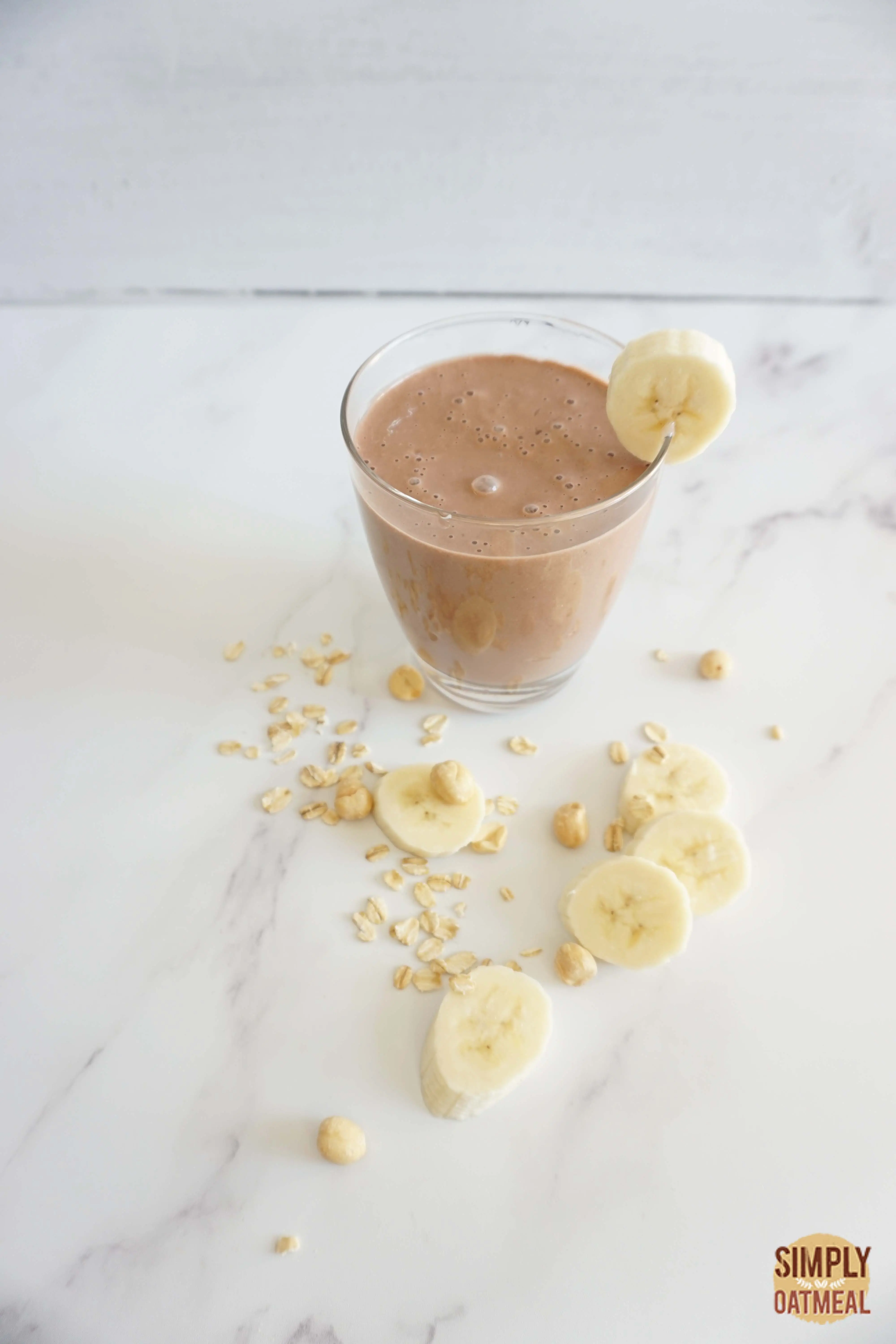 Chocolate peanut butter banana oatmeal smoothie served in a mason jar