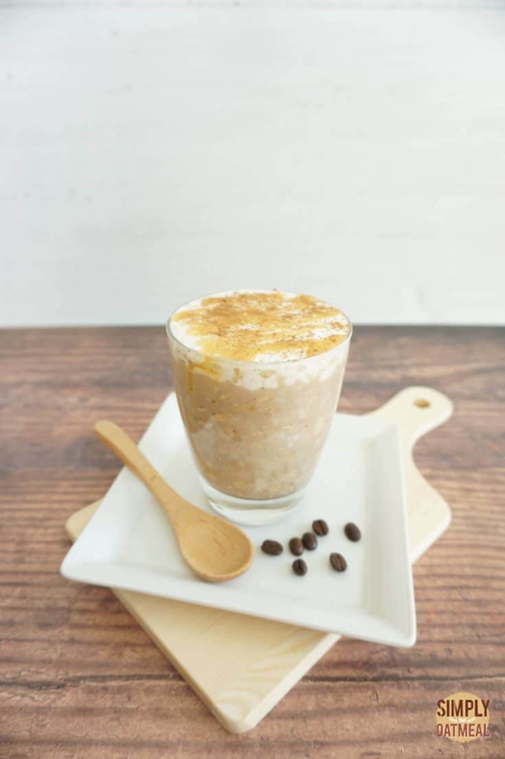 Serving of cinnamon dolce latte overnight oats in a glass cup.