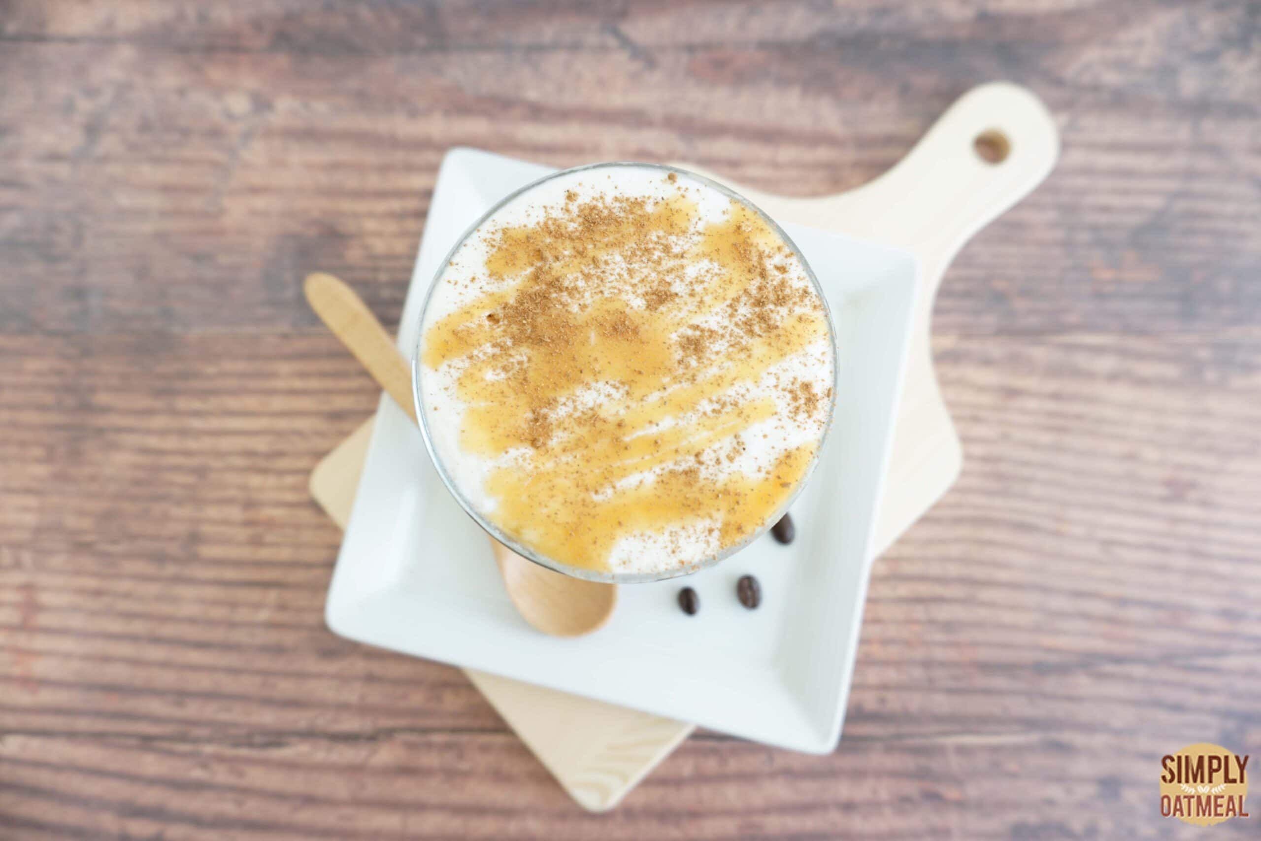 Cinnamon dolce latte overnight oats topped with hot milk foam, caramel sauce and a dash of cinnamon.