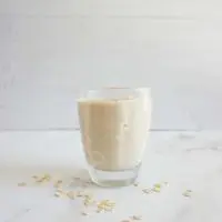 One serving of cinnamon roll oatmeal smoothie in a glass