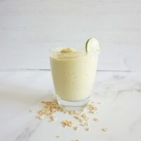 Single serving of keto avocado fat bomb oatmeal smoothie in a glass cup.