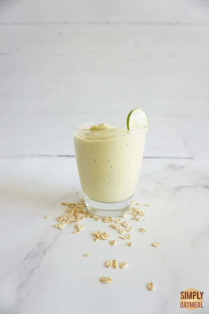 Single serving of keto avocado fat bomb oatmeal smoothie in a glass cup.